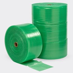 Rolls of green bubble cushioning stacked neatly, with one roll partially unrolled, showcasing the protective bubble texture, set against a light gray background.